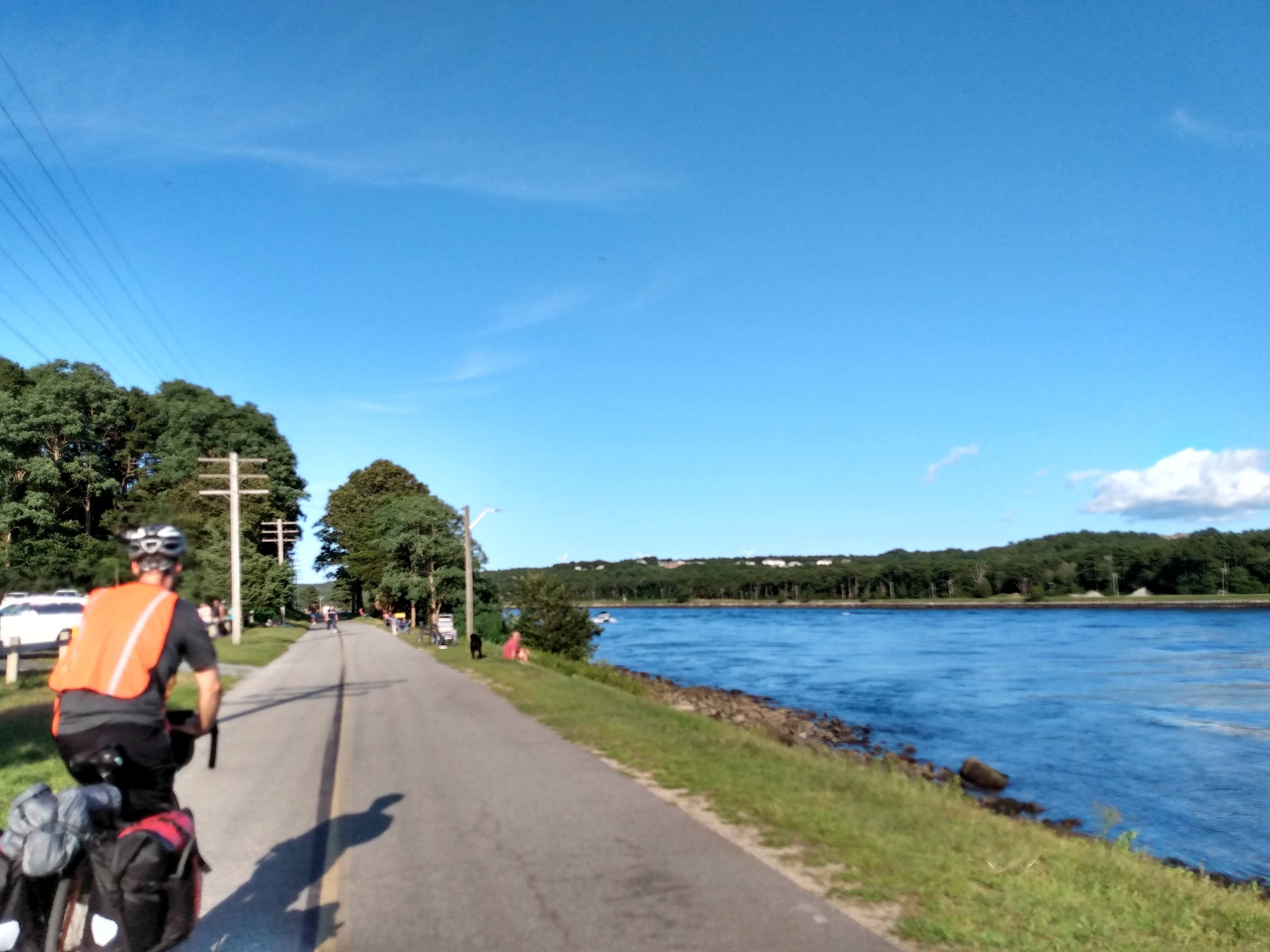 Biking through crowds enjoying the weather along the Cape Cod Canal.