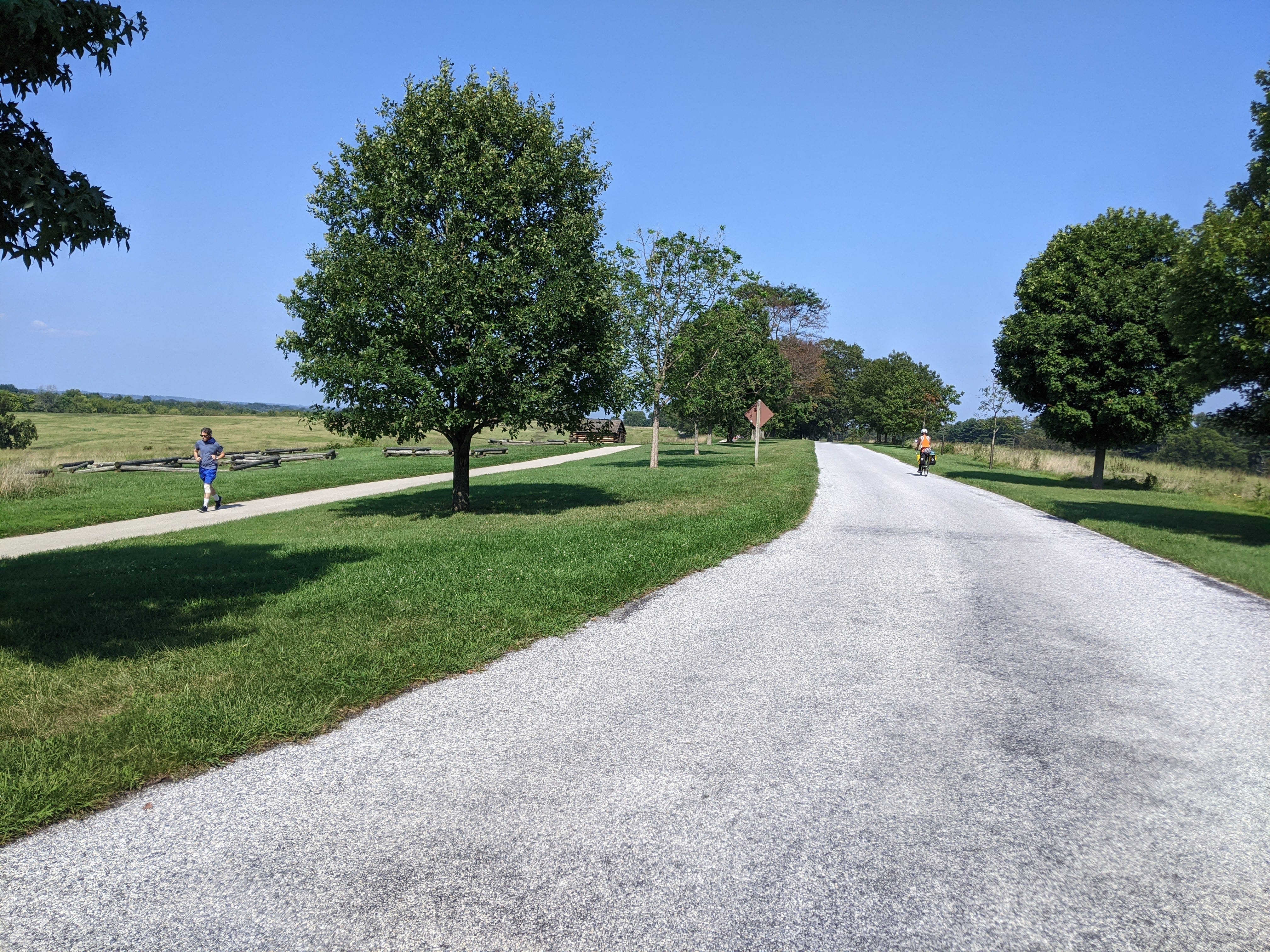 Cycling through Valley Forge National Historic Park. Some restored ruins of the continental army's 1777-1778 winter encampment are visible on the left.