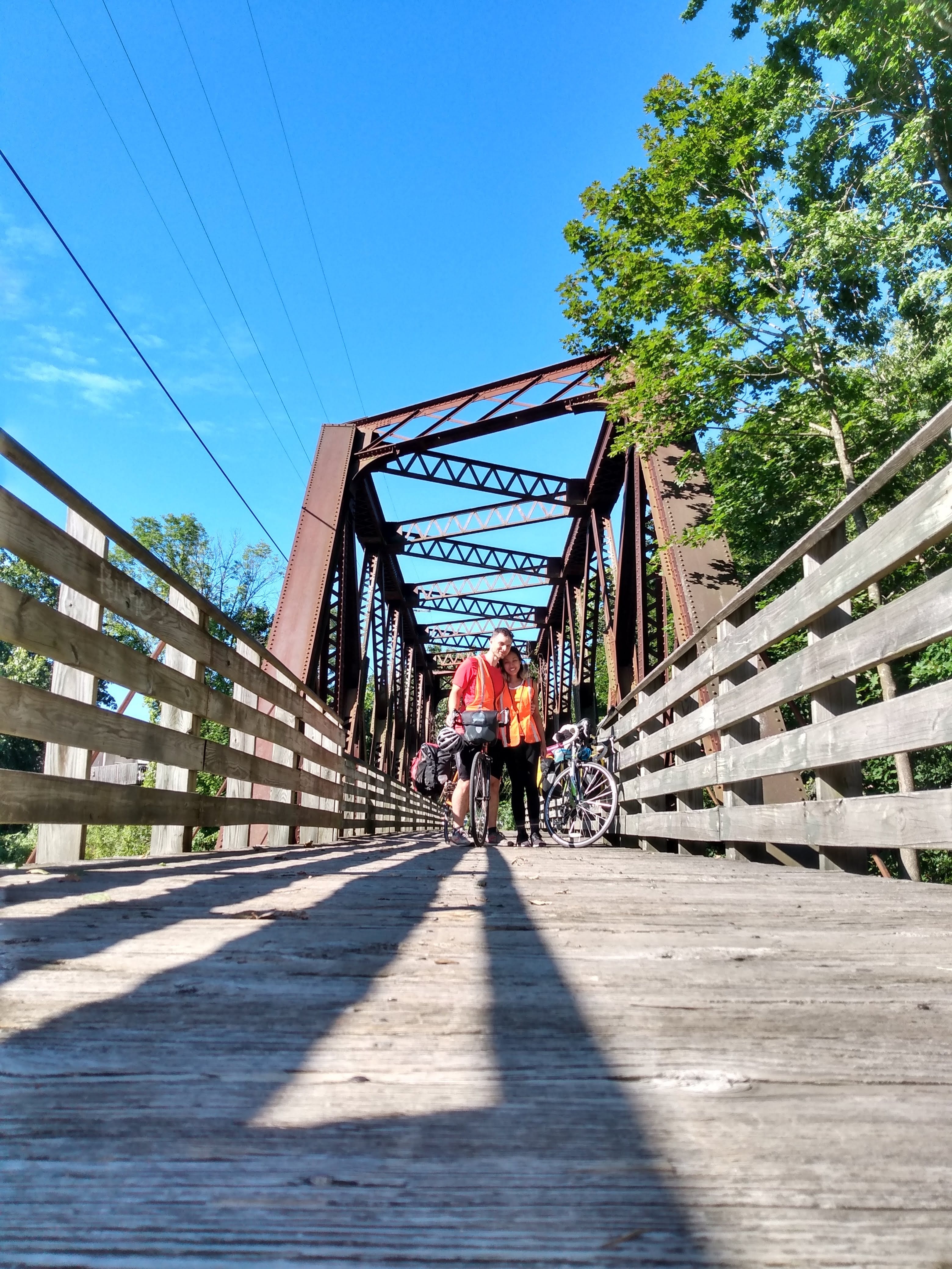 Stopping to enjoy the view a wooden bridge crossing the Moosup River