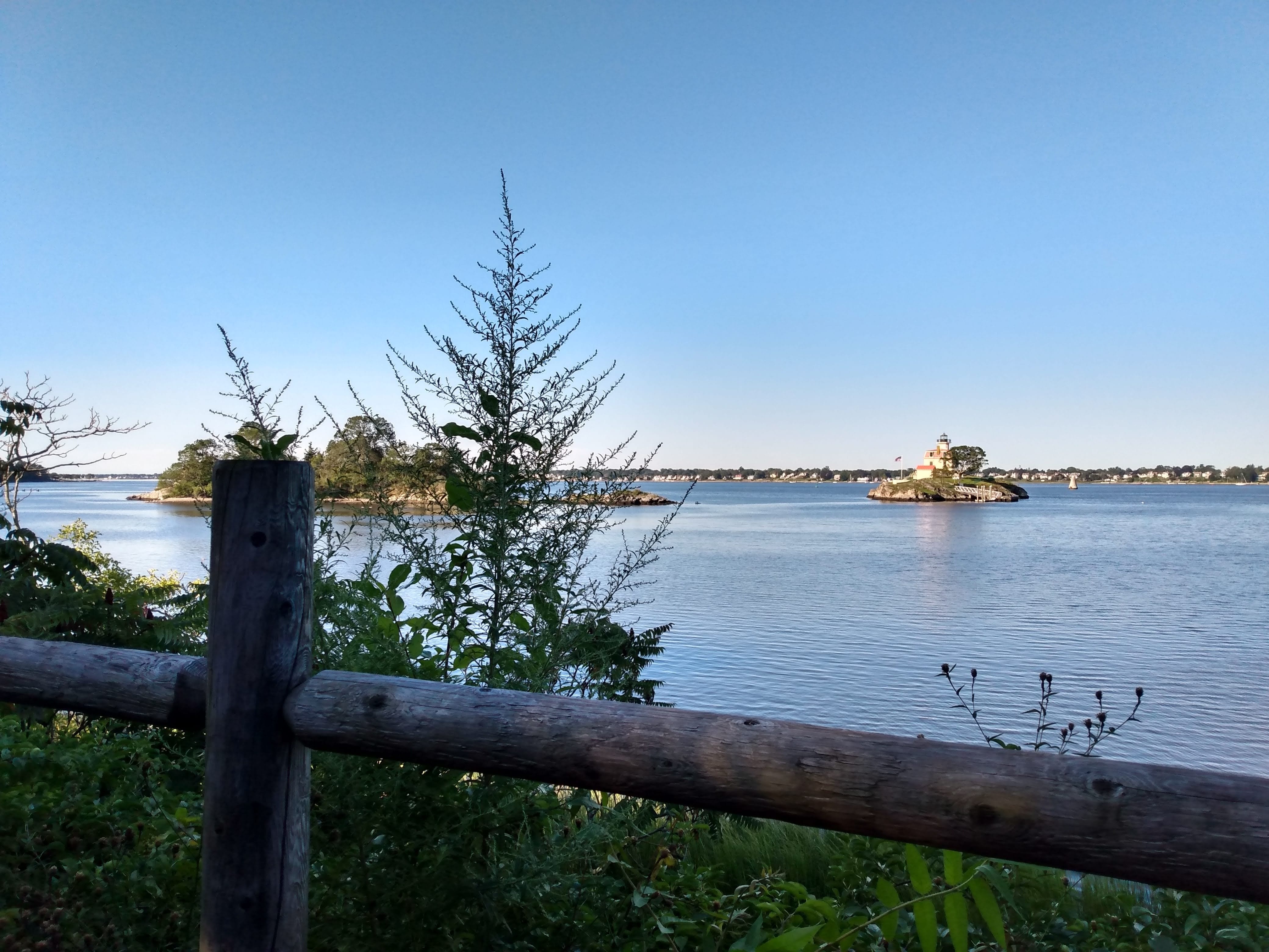 A glimpse of Pomham Rocks Light from the East Providence Bike Path