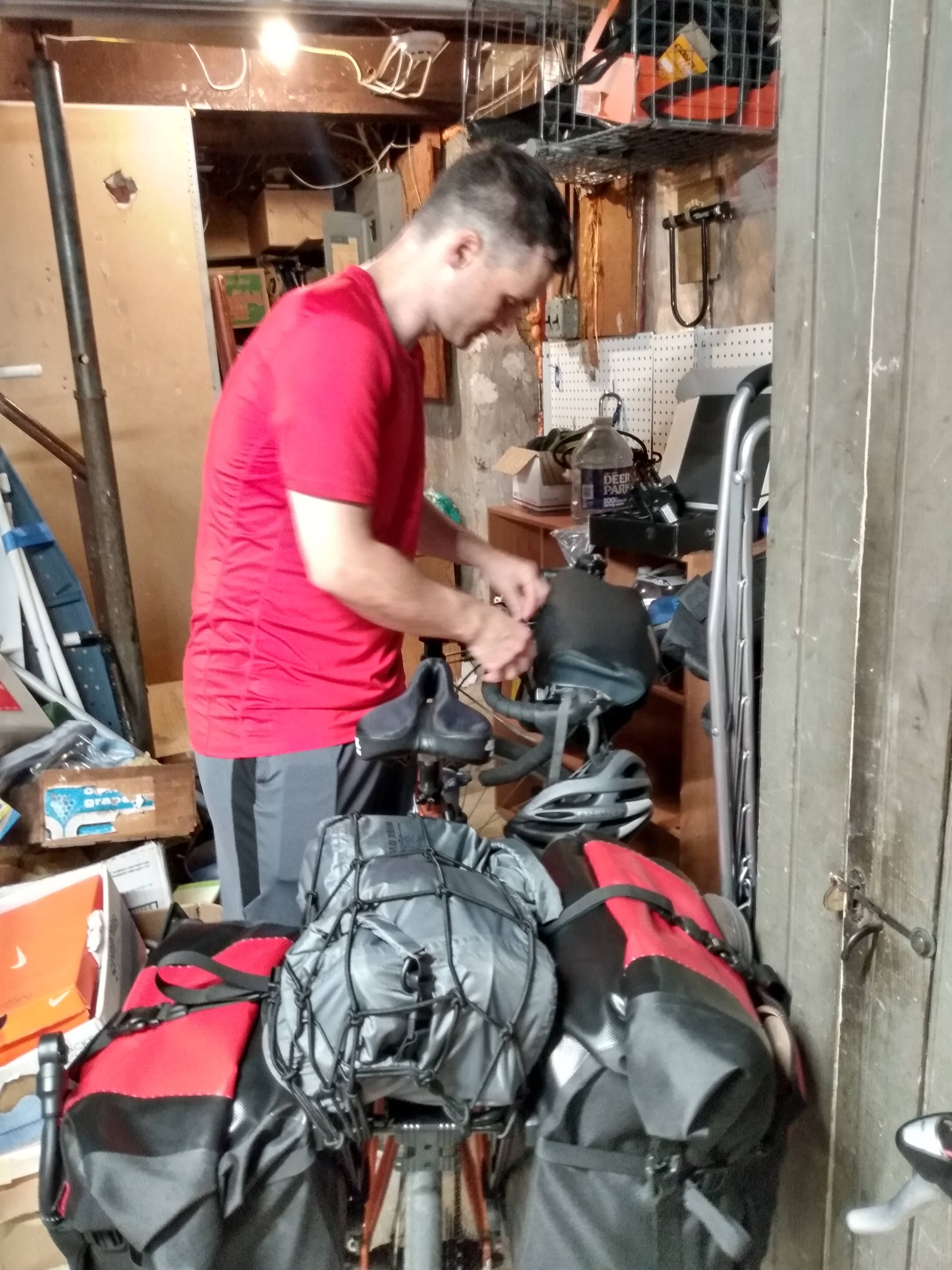 Greg finishing packing gear onto his bike